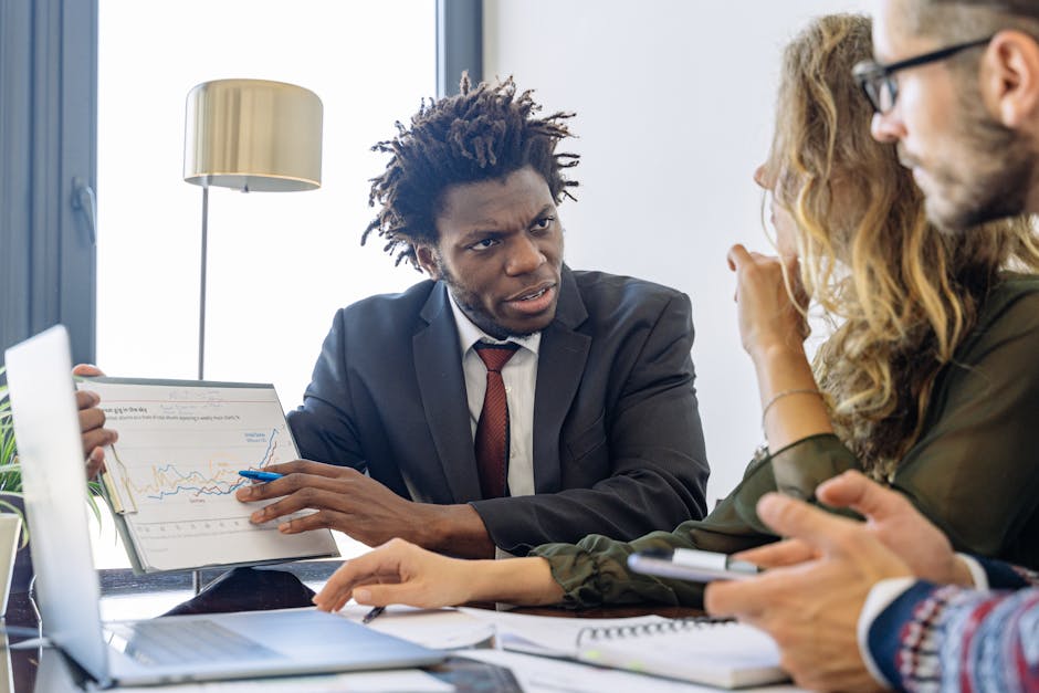 Business professionals discussing financial data during a collaborative meeting